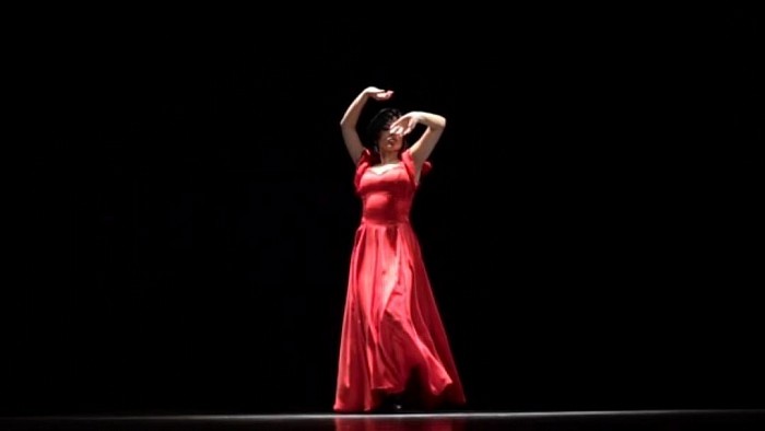 A beautiful dancer is dancing world fame argentine falmanco folk dance.